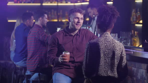 Two Colleagues Drinking at Bar After Work