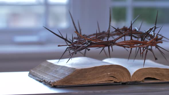 Panning Crown Of Thorns On Top Of The Bible 
