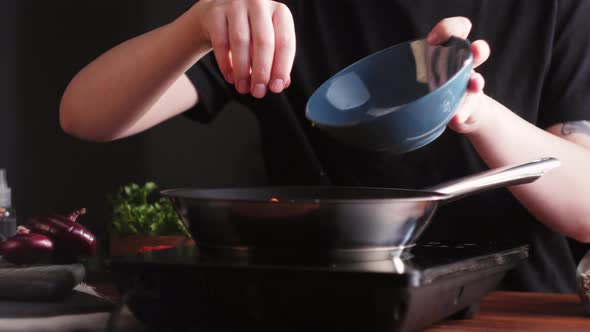 Chef Frying Vegetables in Pan Closeup