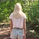 Young millennial woman walking throught the summer forest - VideoHive Item for Sale