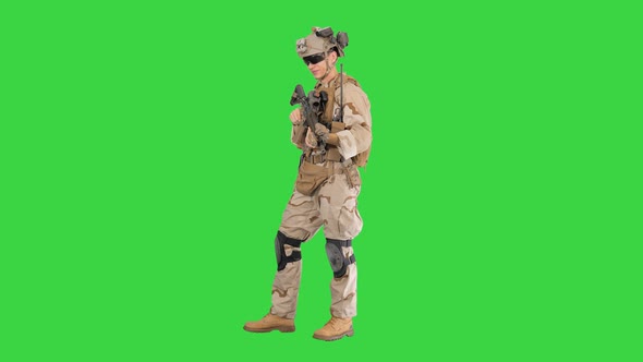 United States Marine Standing And Talking on a Green Screen, Chroma Key.