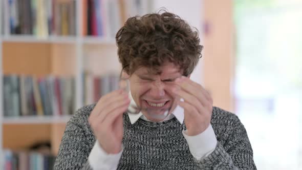 Portrait of Stressed Young Man Having Headache