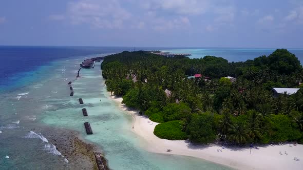 Aerial landscape of tourist beach trip by blue lagoon with sand background