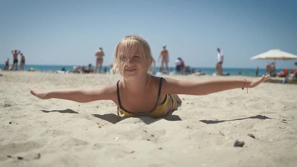 Happy Child Girl Having Fun at the Beach. Summer Vacation Concept