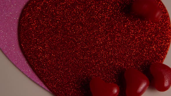 Rotating stock footage shot of Valentines decorations and candies - VALENTINES 0121