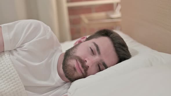 Attractive Young Man Trying To Sleep in Bed