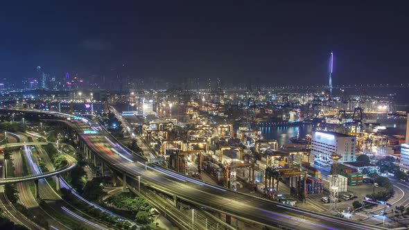 Hong Kong Skyline and Container Terminal in Port at Night Timelapse