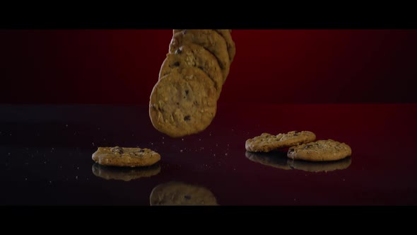 Falling cookies from above onto a reflective surface - COOKIES 192