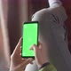 Young Woman at Home Lyung and Use Smartphone with Green Screen - VideoHive Item for Sale