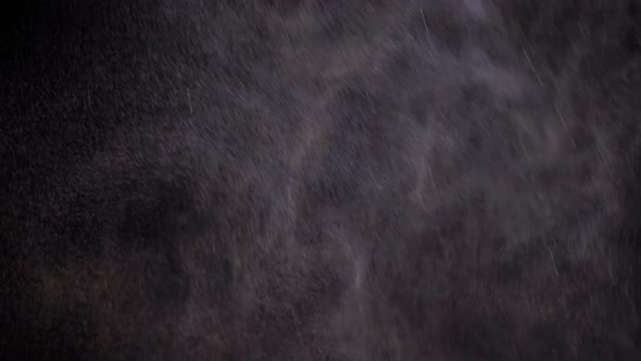 Water Spray Against Black Background. Slow Motion alt