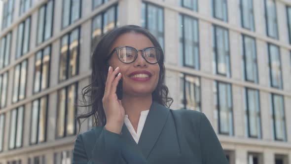 Businesswoman Having Telephone Call Outdoors