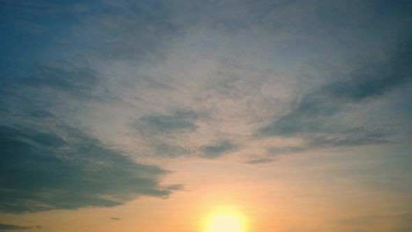 4K UHD : Time lapse of colorful sky during beautiful sunset. Romantic clouds.