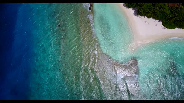 Aerial landscape of relaxing bay beach break by blue ocean with white sand background of a dayout ne