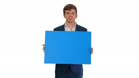 Young Businessman Holding Blank Sign Looking at Camera on White Background