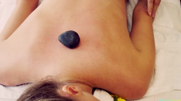 Hot Stone Massage Treatment By Therapist in Spa