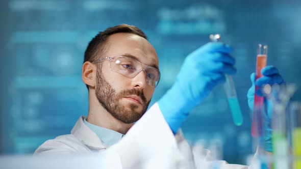 Male Scientist Worker Making Pharmacology Substance Using Beaker at Digital Lights Background