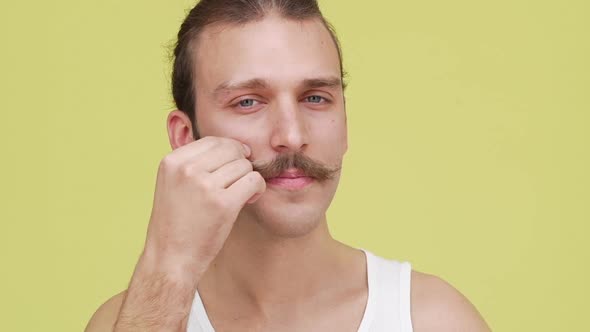 Portrait of Skinny Man Cheerfully Touching His Mustaches and Showing Thumb Closeup Slomo