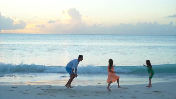 Family of Dad and Kids Enjoying Beach Vacation Playing Together, SLOW MOTION