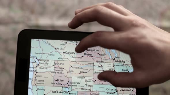 Preparing for the Tourist Trip Using a the Tablet and Map