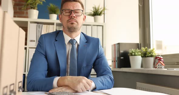 Young Businessman in Glasses Sits Thoughtfully at Workplace and Looks Out Window  Movie