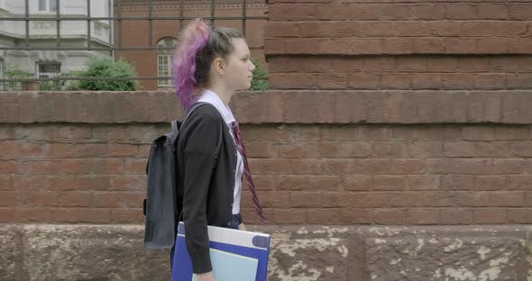 Teenager Girl in Uniform with Backpack Going To School