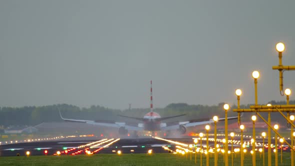 Airliner Landing on the Runway After Landing in a Rainy Weather