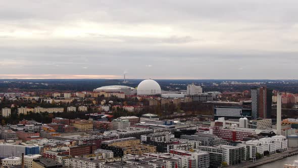 Wide aerial slide showing Stockholm skyline towards Ericsson Globe