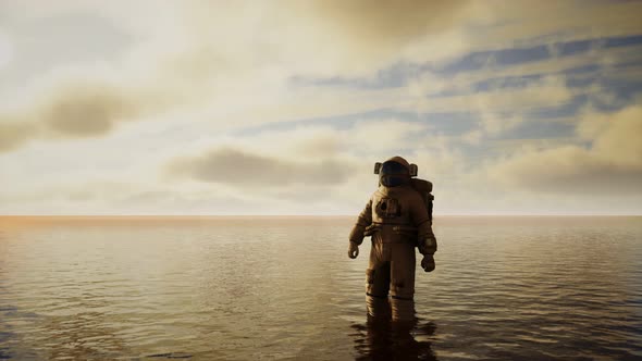 Spaceman in the Sea Under Clouds at Sunset alt