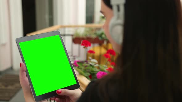 Business Female in Cafe Works with Tablet Video Calls