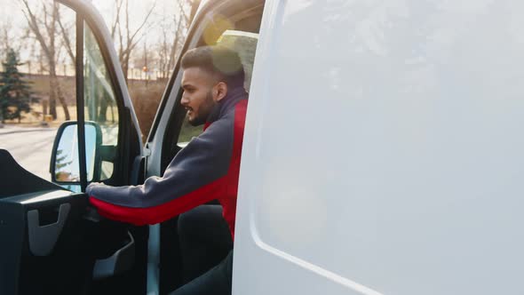 Young Indian Driver Getting Out of the Van