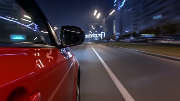 Drivelapse Urban Look From Fast Driving Car at a Night Avenue in a City Timelapse Hyperlapse