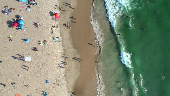 Top View Of Vacationists On The Sandy Shore Of Turquoise Beach Of Manhattan In California, USA. Aeri