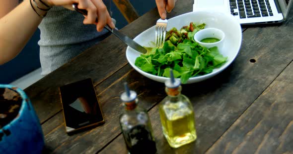 Young Woman Having Salad on The Table 4k