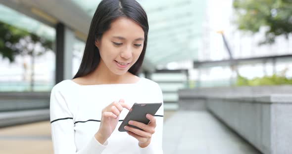 Woman using mobile phone at outdoor