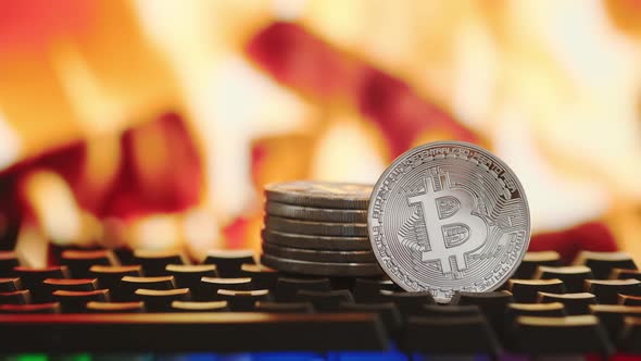 Bitcoin Cryptocurrency on Blurred Background of Fire