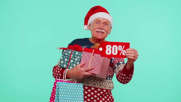 Grandfather in Christmas Sweater Showing Gift Box and 80 Percent Discount Inscriptions Banner Text