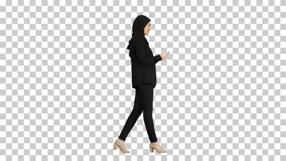 Pretty woman in hijab walking and counting money, Alpha Channel