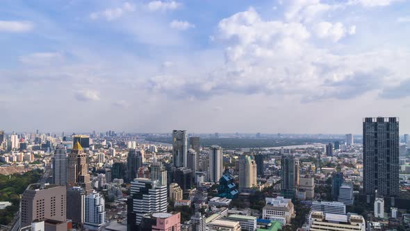 Bangkok business district city center and Chao Phraya River; panning right – Time Lapse