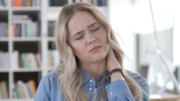 Tired Young Woman with Neck Pain