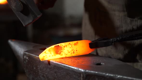 Closeup of Blacksmith Forging Blade of Knife