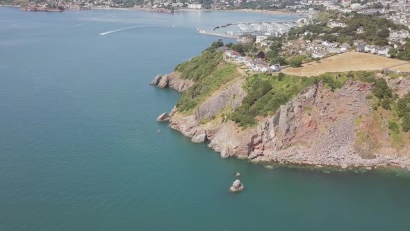 Beautiful aerial shot of a Cliffside, near small town.