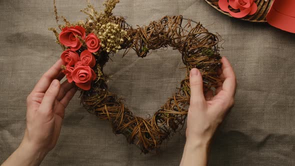 Female Hands with Valentines Day DIY Decoration