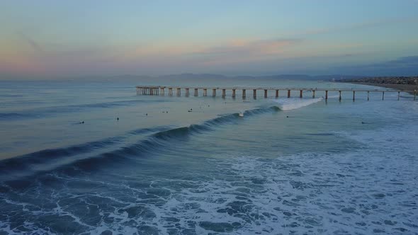 Aerial drone uav view of a pier, beach and ocean.