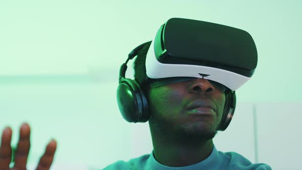 Man Wearing Virtual Reality Glasses Enjoying the 360 Degree Virtual Environment