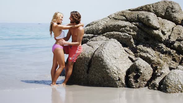 Romantic couple standing at beach