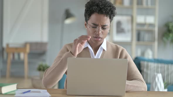 Young African Girl Using Laptop And Having Headache