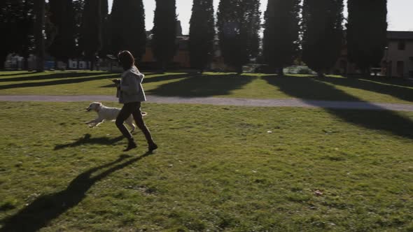 Woman with the dog at the park