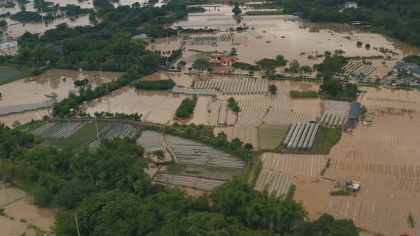 Flood Water Causes Damage in Agricultural Business in China, Aerial View