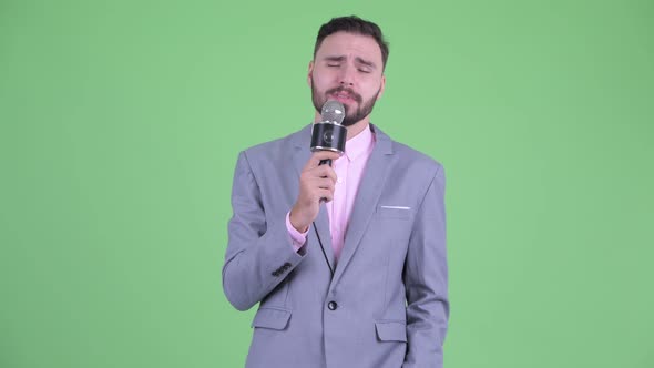 Funny Young Bearded Businessman As Newscaster Making Mistake