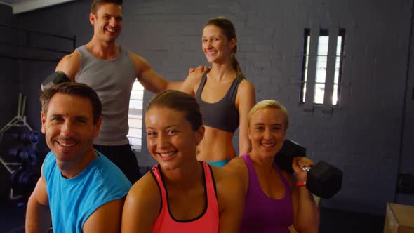 Group of people sitting with fitness equipment